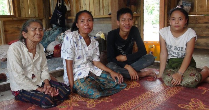 Ms Vanh (second from left), two of her children and her mother in Vanh's new house.